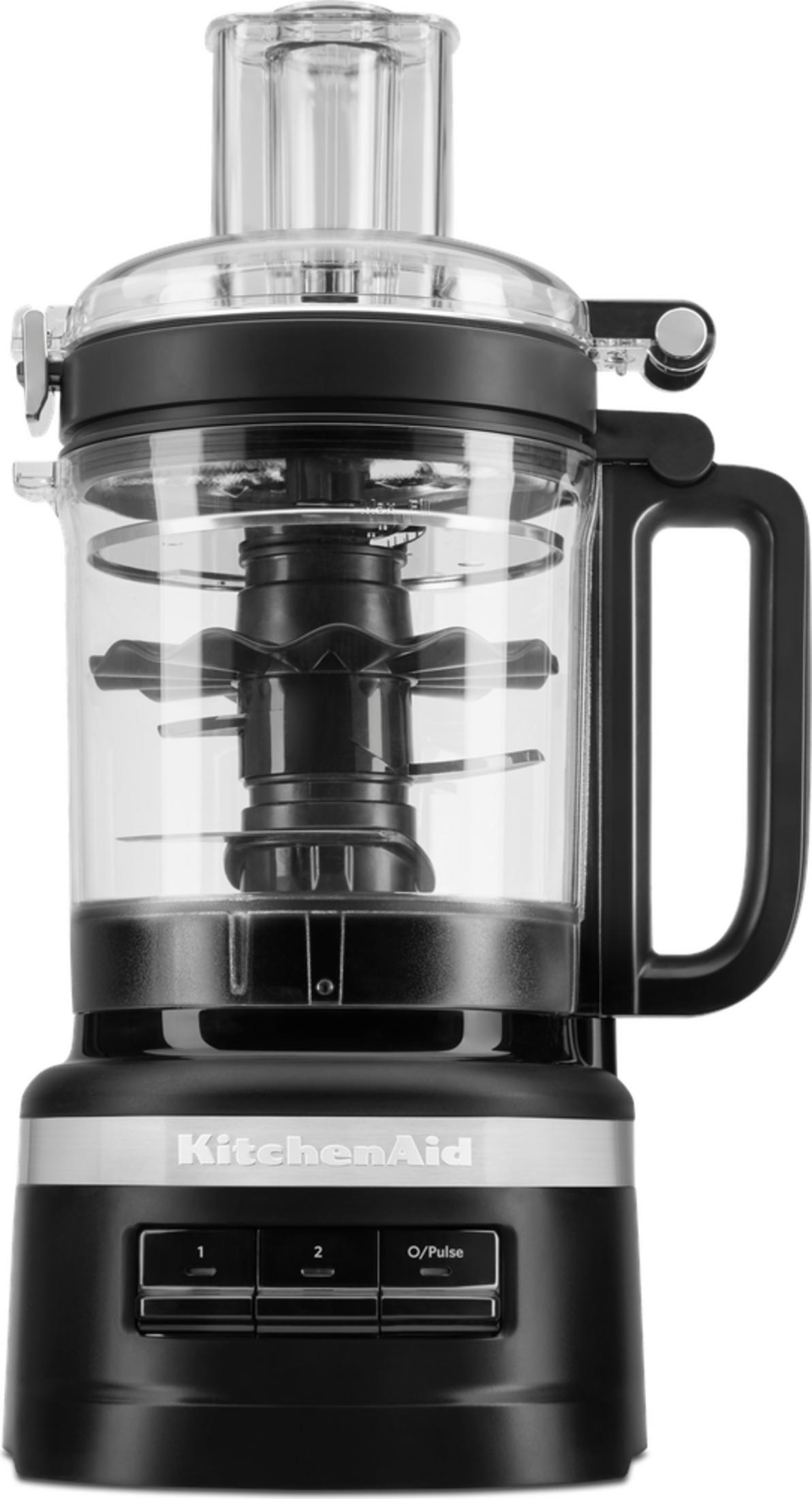Siyah ve şeffaf KitchenAid mutfak robotu, saplı, içinde bıçaklar ve tabanında üç kontrol düğmesi bulunuyor.