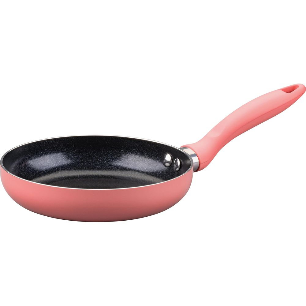 Eine kleine rosa Pfanne mit schwarzer Antihaftbeschichtung und einem Griff.