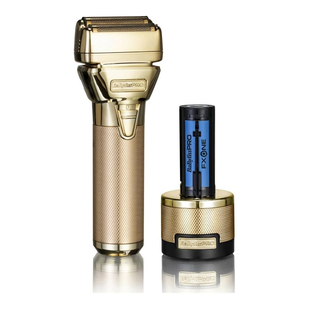 Rasoio elettrico dorato con base di ricarica e due pacchi batteria blu.