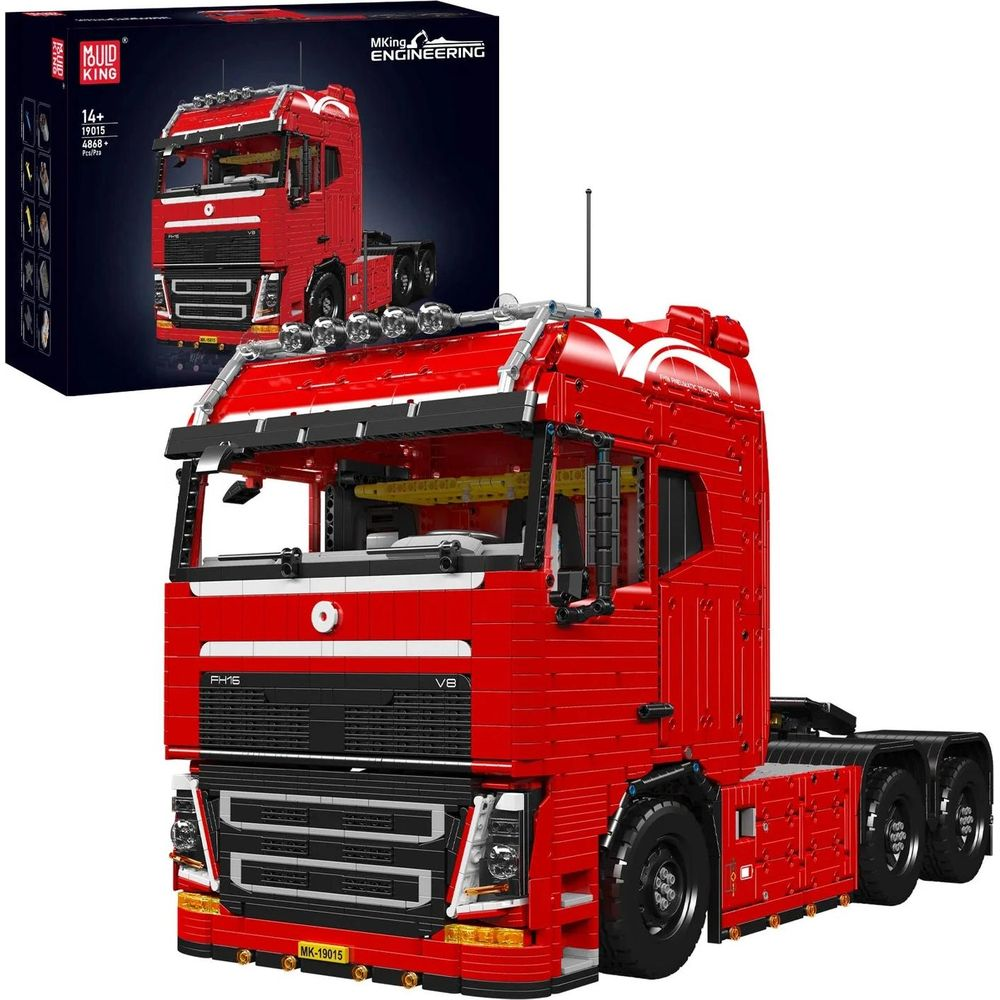 Un modèle de camion jouet rouge avec une boîte derrière. Le camion est très détaillé.