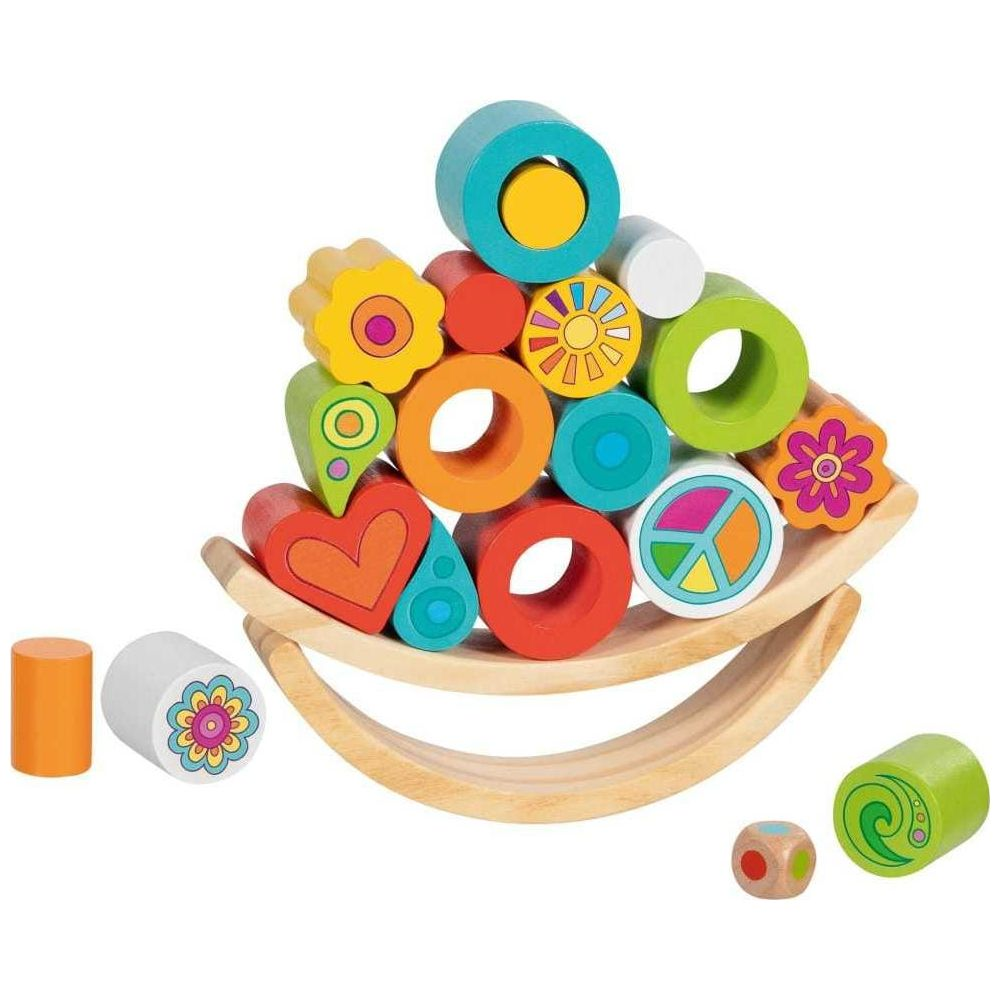 Ein hölzerner Wippen-Stapelspielzeugturm mit bunten geometrischen und blumenförmigen Blöcken.