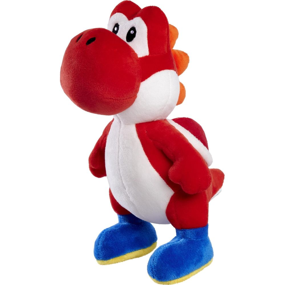 Ein roter Yoshi-Plüsch mit weißen Akzenten und blauen Stiefeln steht.