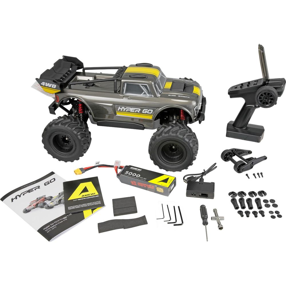 Graues RC-Monster-Truck-Kit mit Fernbedienung, Akku, Ladegerät und Werkzeug.