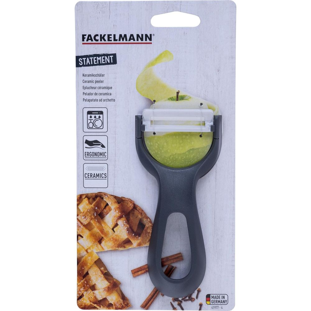 Ein Fackelmann Keramikschäler mit Apfel und Kuchen im Detail.