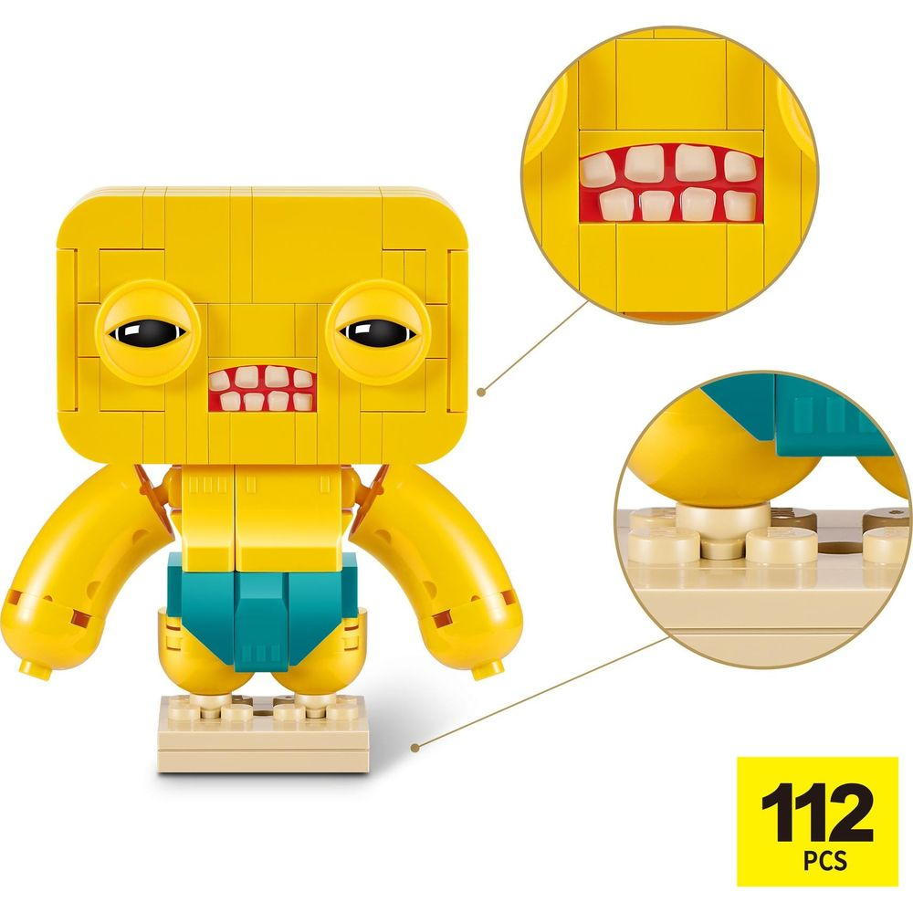 Ein gelber Lego-Roboter mit großen Augen und einem Mund mit Zähnen.