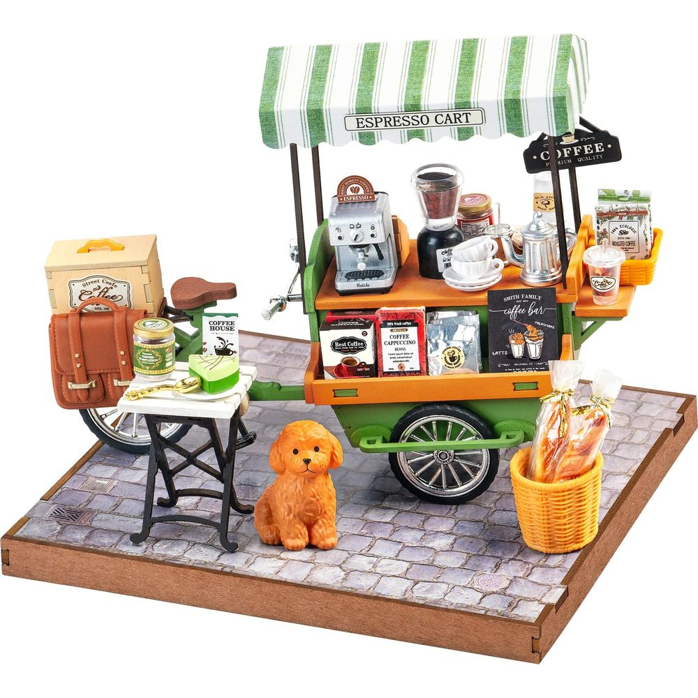 Miniatur-Kaffeewagen mit Espressomaschine, Mühle, Tassen, Kaffeetüten und einem kleinen Hund.