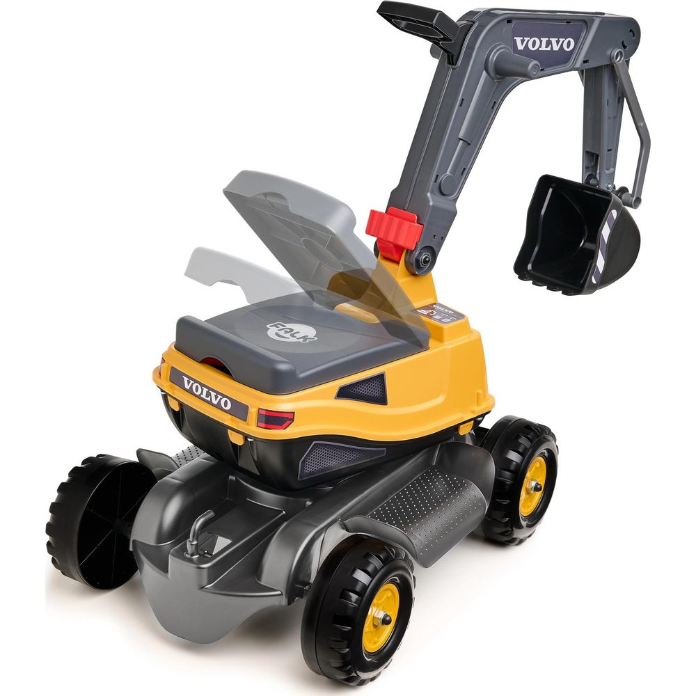 Ein gelber und grauer Spielzeug-Volvo-Bagger mit schwarzen Rädern.