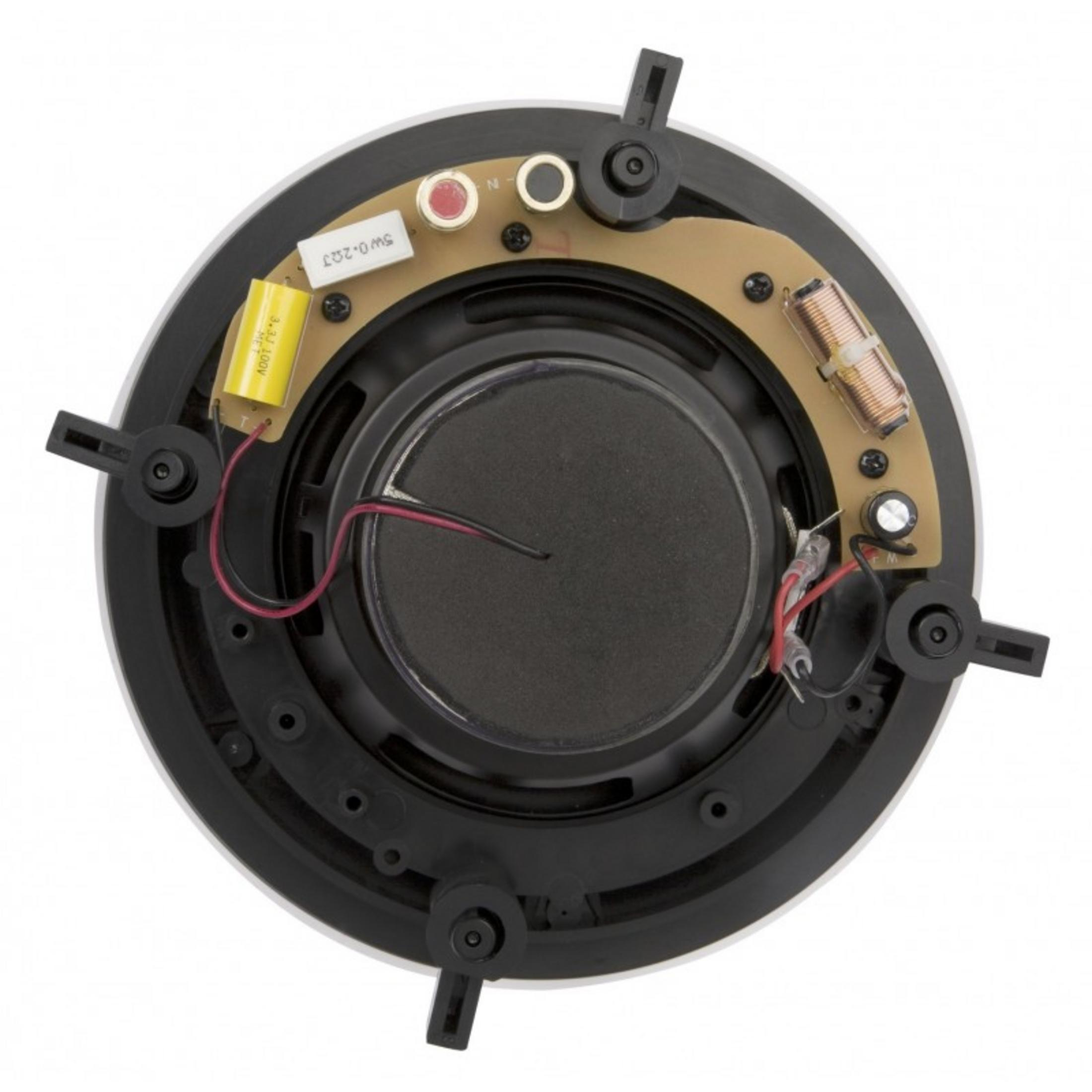 Back view of a speaker showing a coil, capacitor, and wiring.