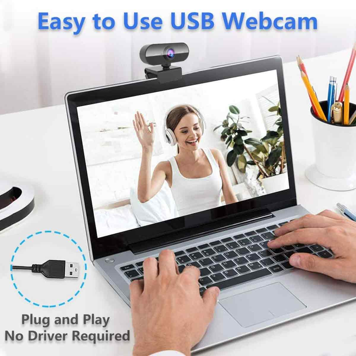 Ein USB-Webcam ist auf einem Laptop montiert. Eine Frau winkt auf dem Bildschirm.