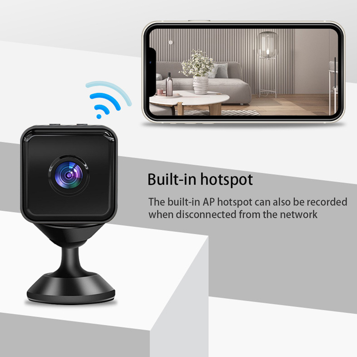 Kleine schwarze Kamera mit WLAN-Symbol und Smartphone-Anzeige eines Wohnzimmers.