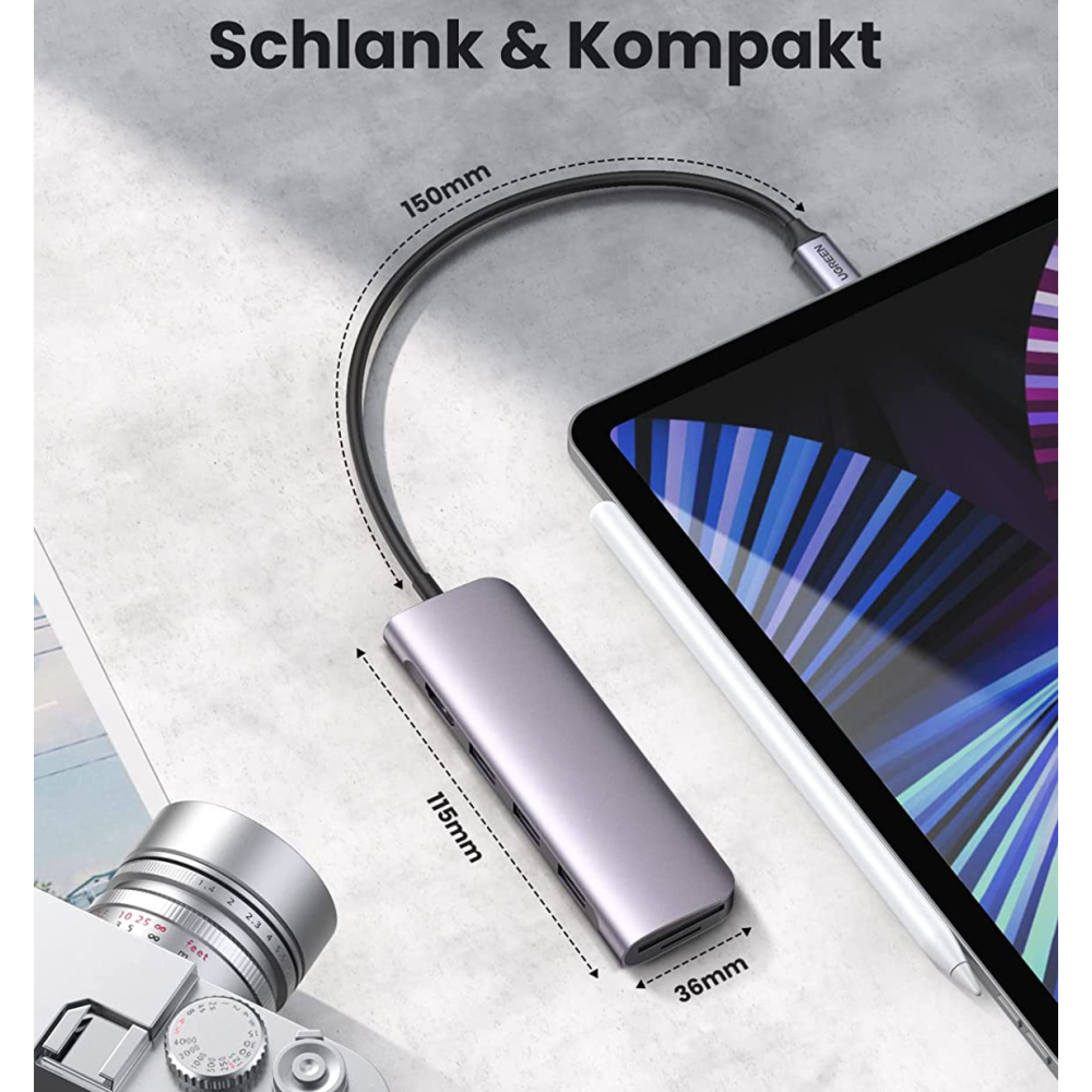 Ein schlanker USB-C-Hub, ein Tablet und eine Kamera.