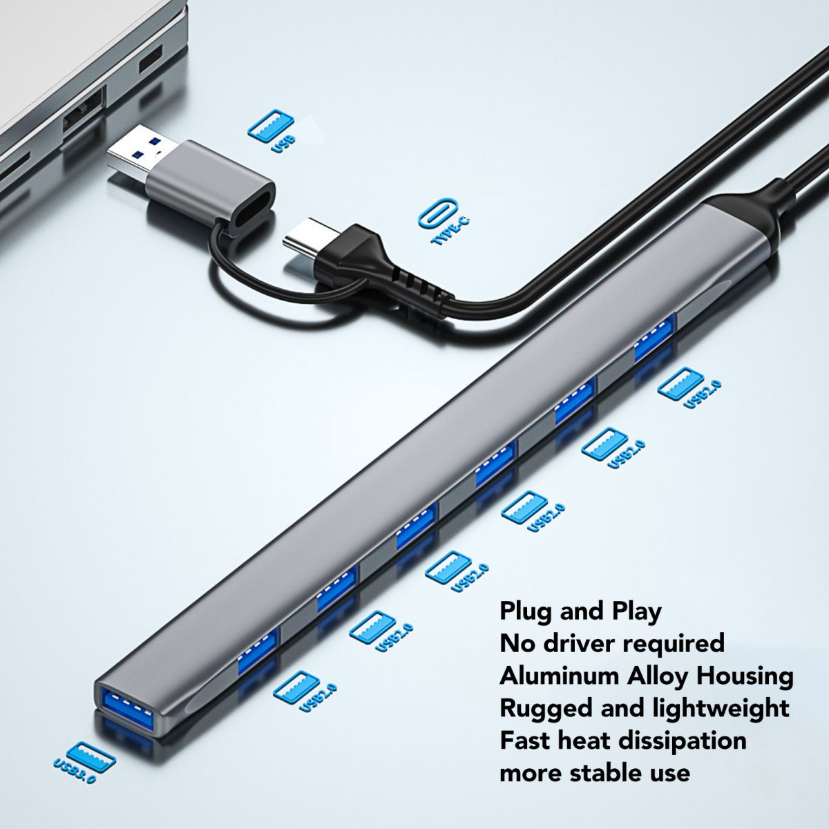 Grauer USB-C-Hub mit mehreren Anschlüssen, verbunden mit einem Laptop.