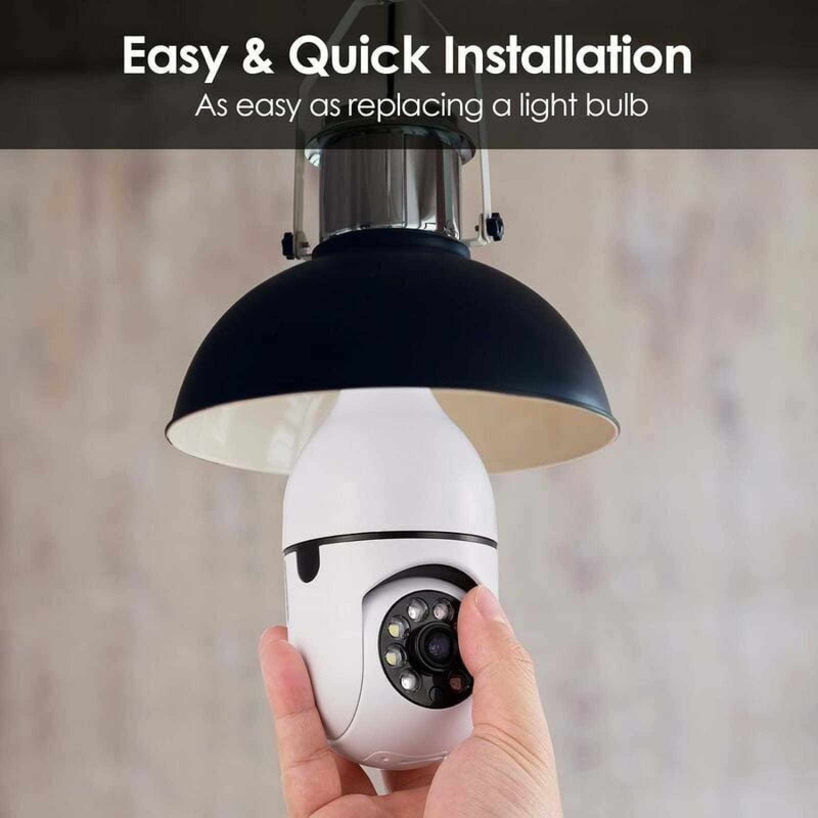 Eine Hand hält eine weiße Glühbirnenkamera unter einer schwarzen Lampe.
