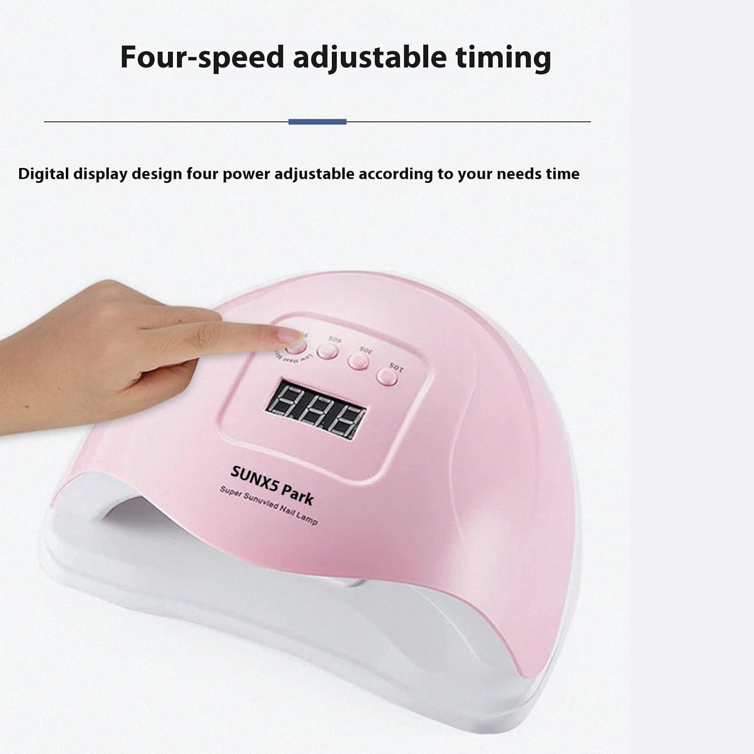 Eine Hand drückt auf eine rosa Nagellampe mit digitaler Anzeige und Knöpfen.