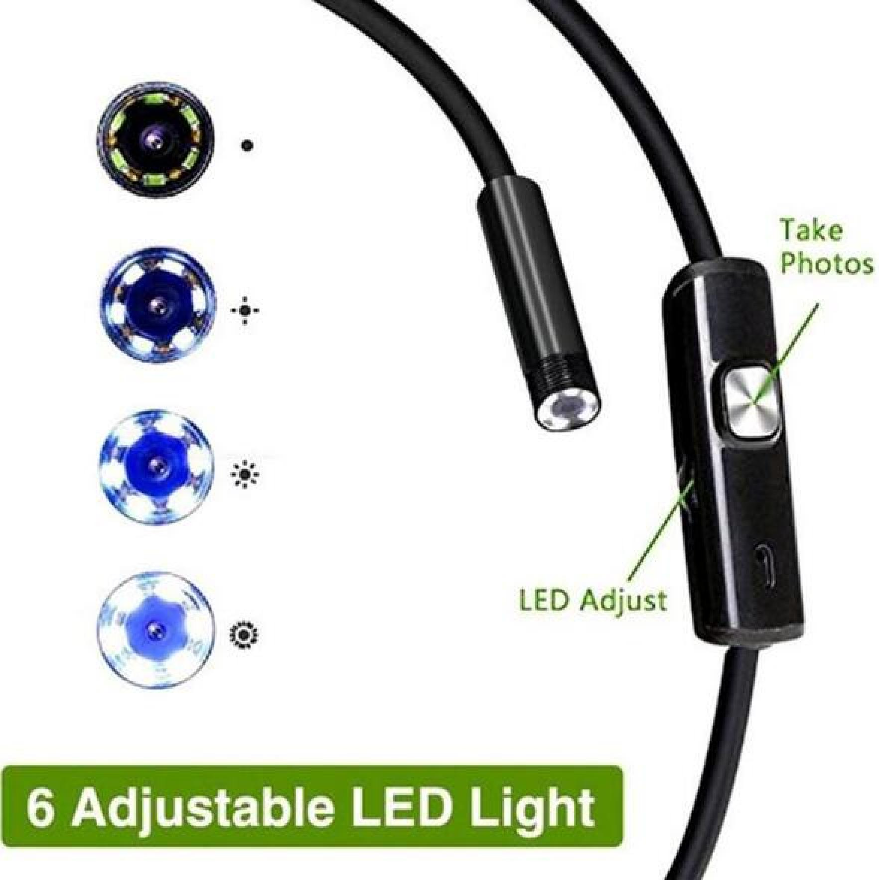 Ein schwarzes Kabel mit einem Griff und einem Licht. Es gibt auch vier Kameralinsen mit Lichtern.