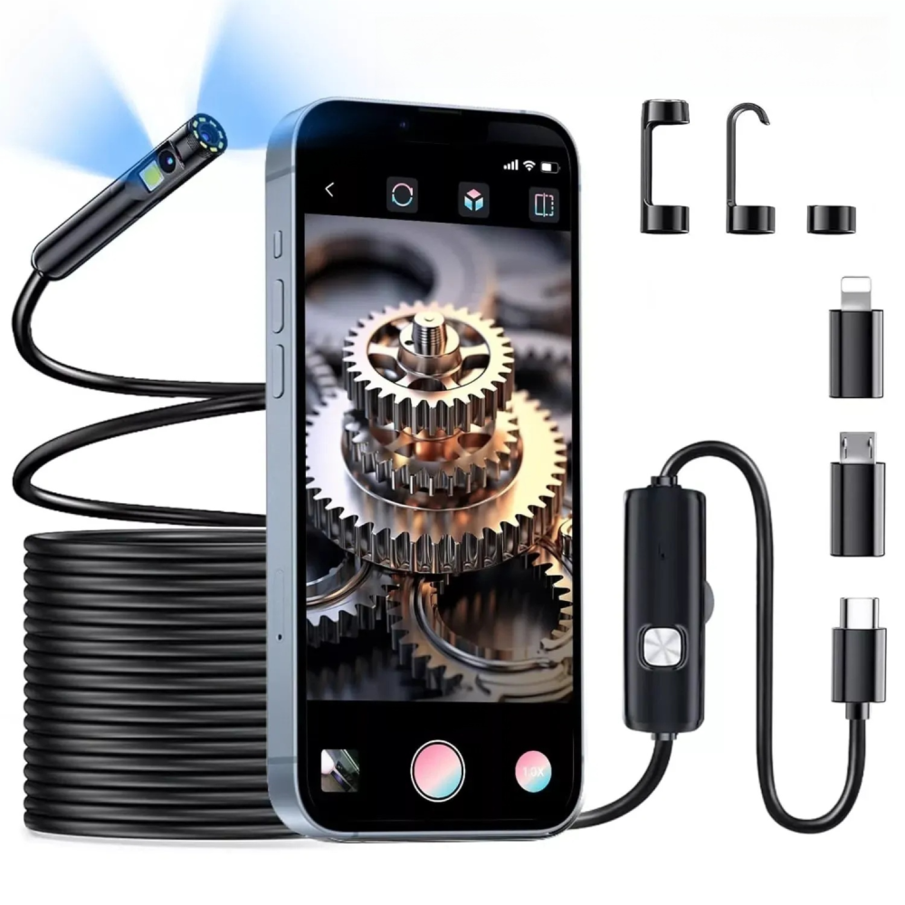 Ein Smartphone zeigt Zahnräder; daneben eine Kamera mit Kabel und Zubehör.