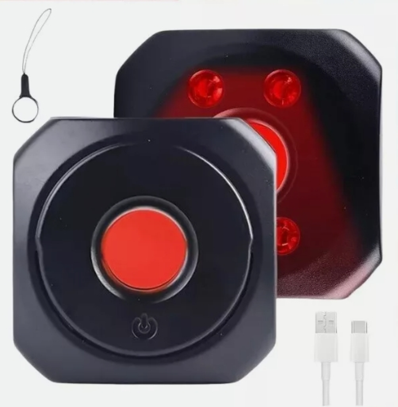 Zwei schwarze Geräte mit roten Lichtern und USB-Kabeln.