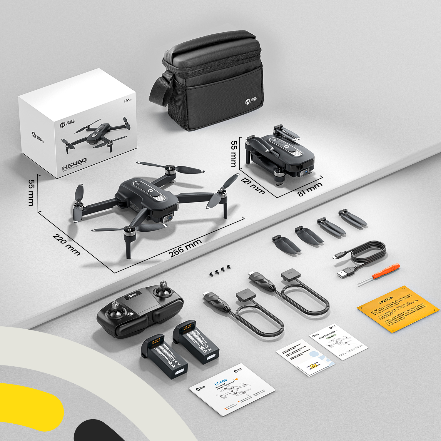 Ein schwarzer HS460 Drohnen-Kit mit Zubehör, Batterien, Fernbedienung und Tasche.
