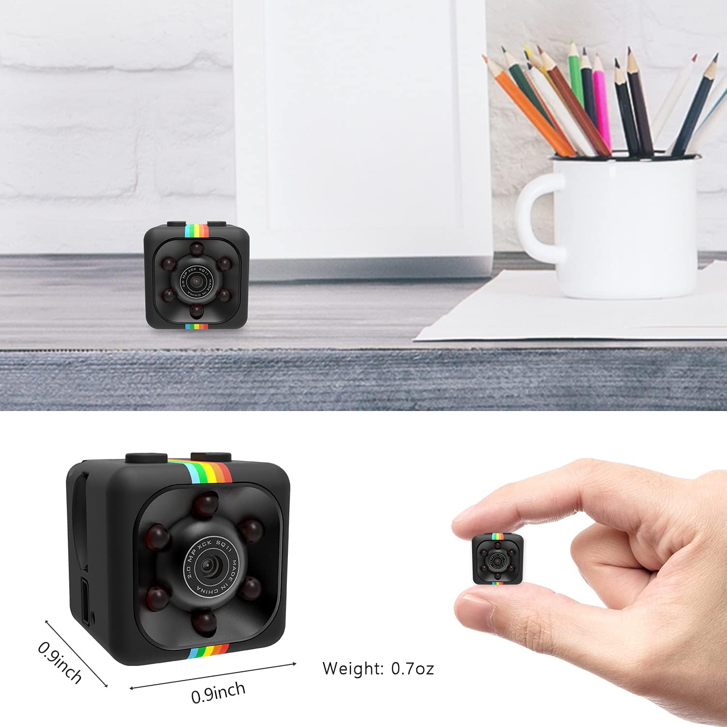 Eine winzige schwarze Kamera, 0,9x0,9 Zoll und 0,7oz, zwischen Fingern gehalten.
