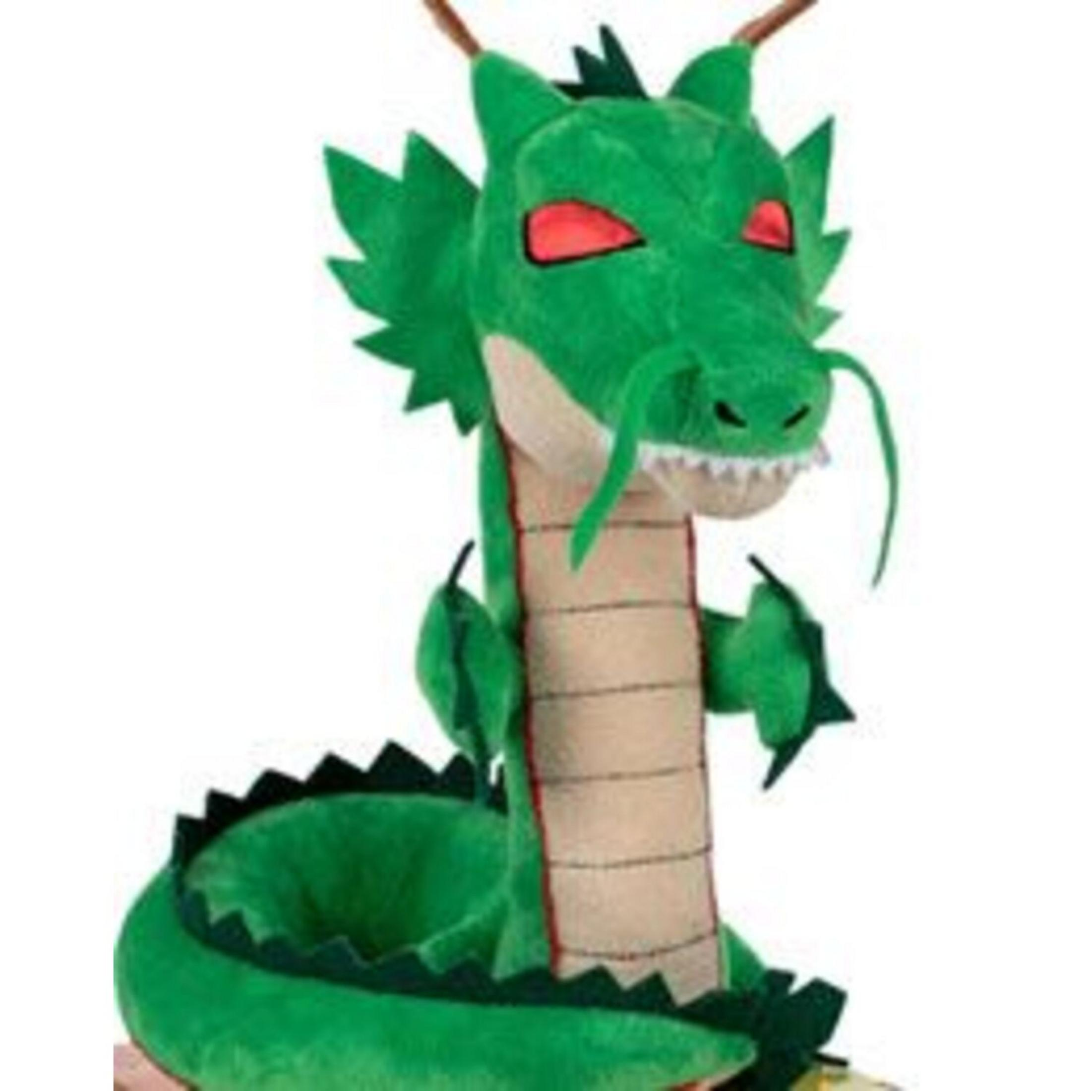Un peluche drago verde con occhi rossi e denti bianchi.