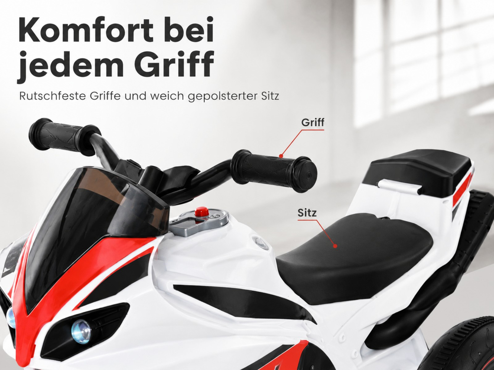 Ein weißes Kinder-Elektrofahrrad mit roten Akzenten, schwarzem Sitz und Griffen.