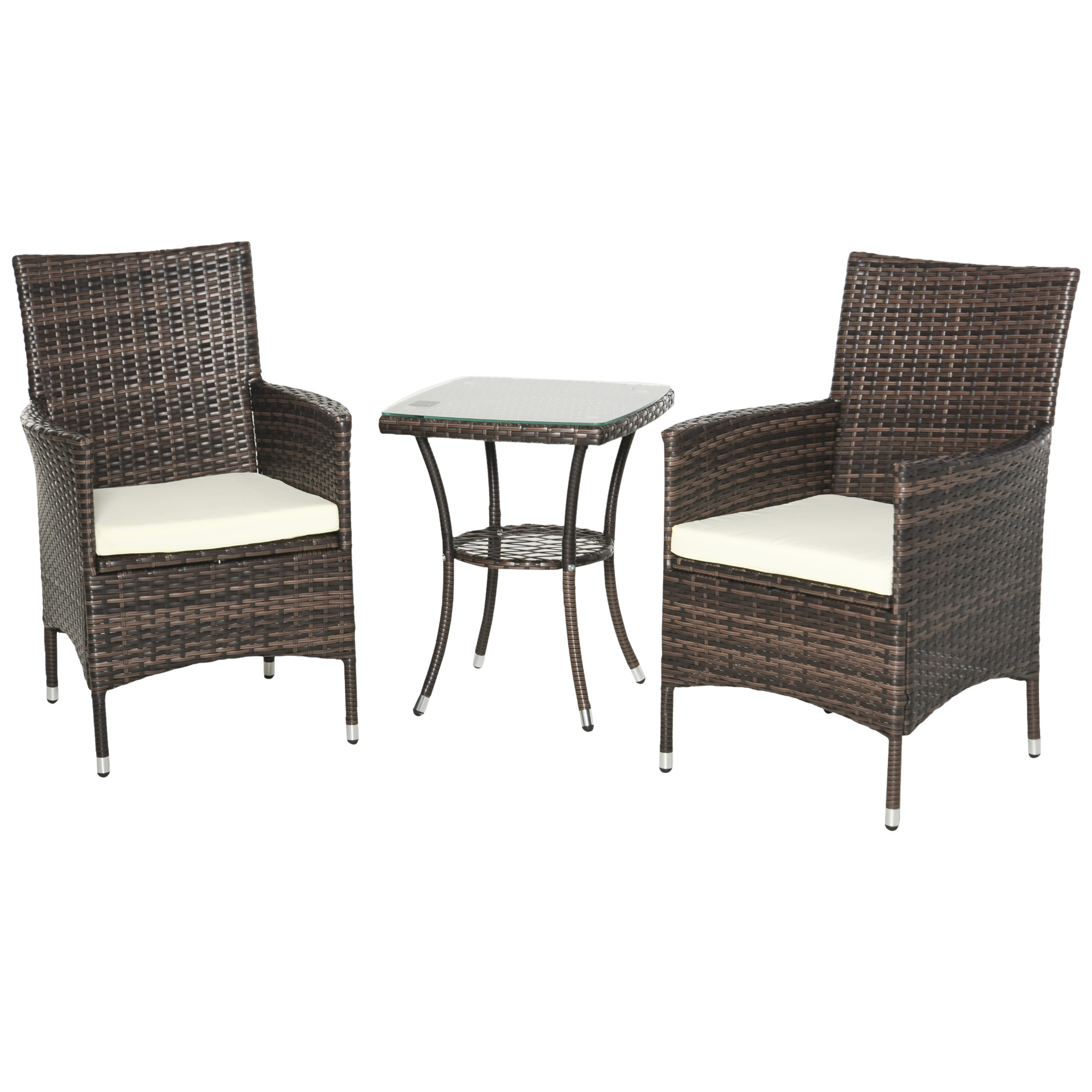 Sedie in rattan marrone con cuscini bianchi e tavolino in vetro.