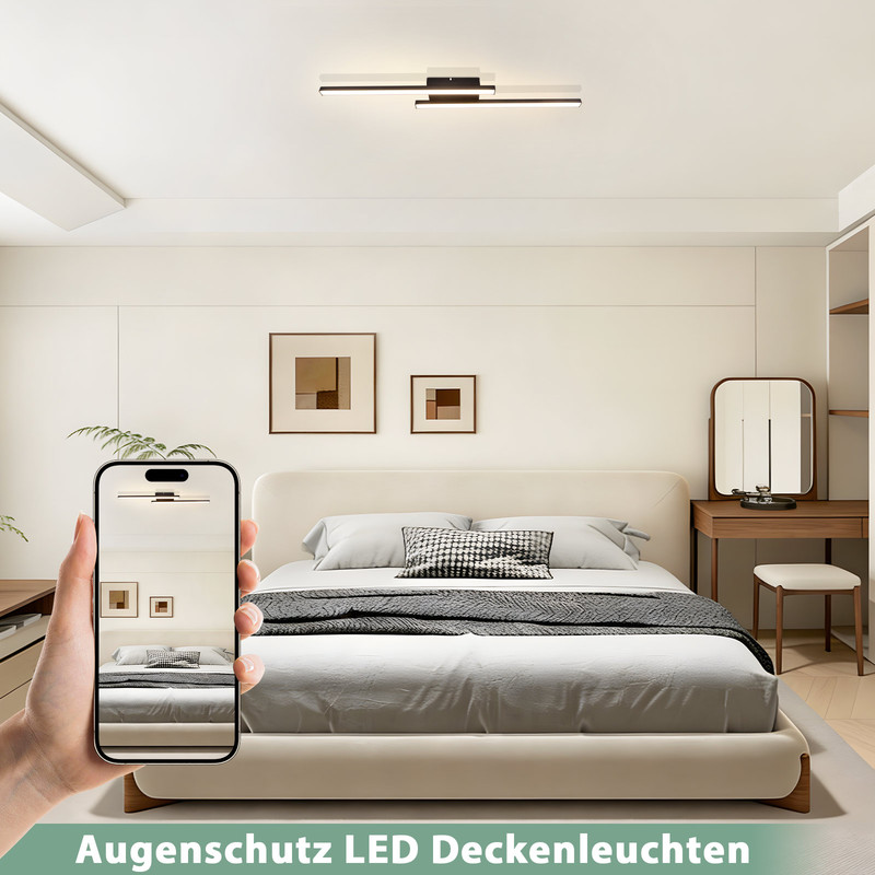 Modernes Schlafzimmer mit Bett, Schminktisch und einer Hand, die ein Handy hält.
