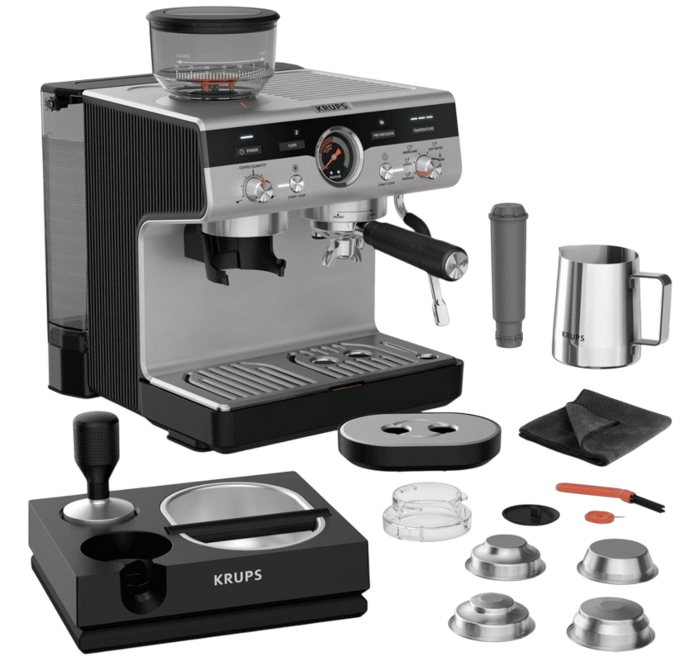 Krups Espressomaschine mit Mühle, Tamper, Siebträger, Milchkännchen, Filter und Reinigungswerkzeug.