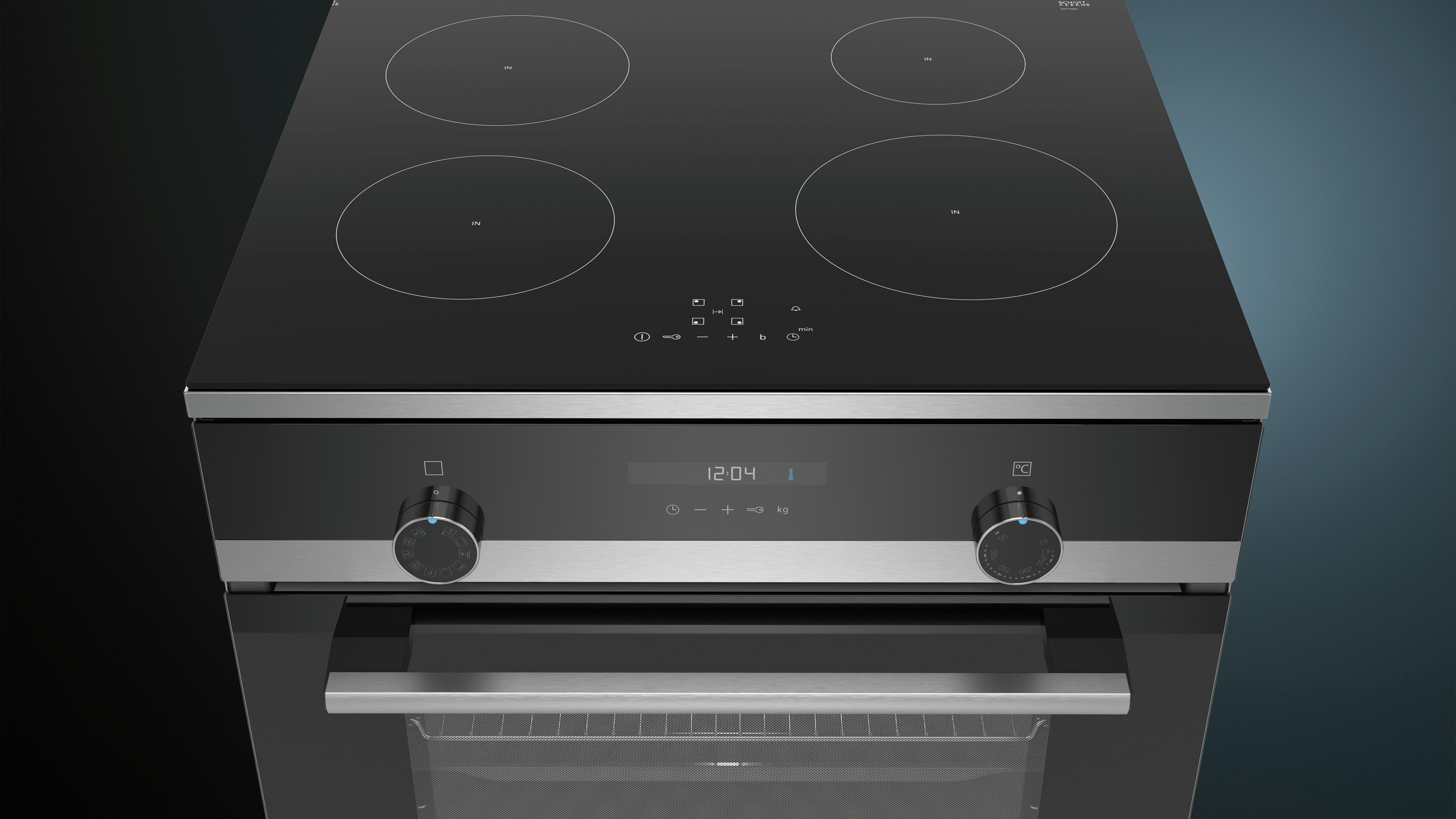 Un moderno piano cottura a induzione nero con quattro zone e un forno.