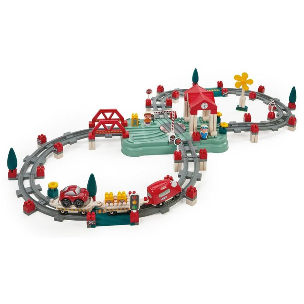 Set trenino giocattolo con binari rossi e bianchi, due treni, un ponte rosso e figure.