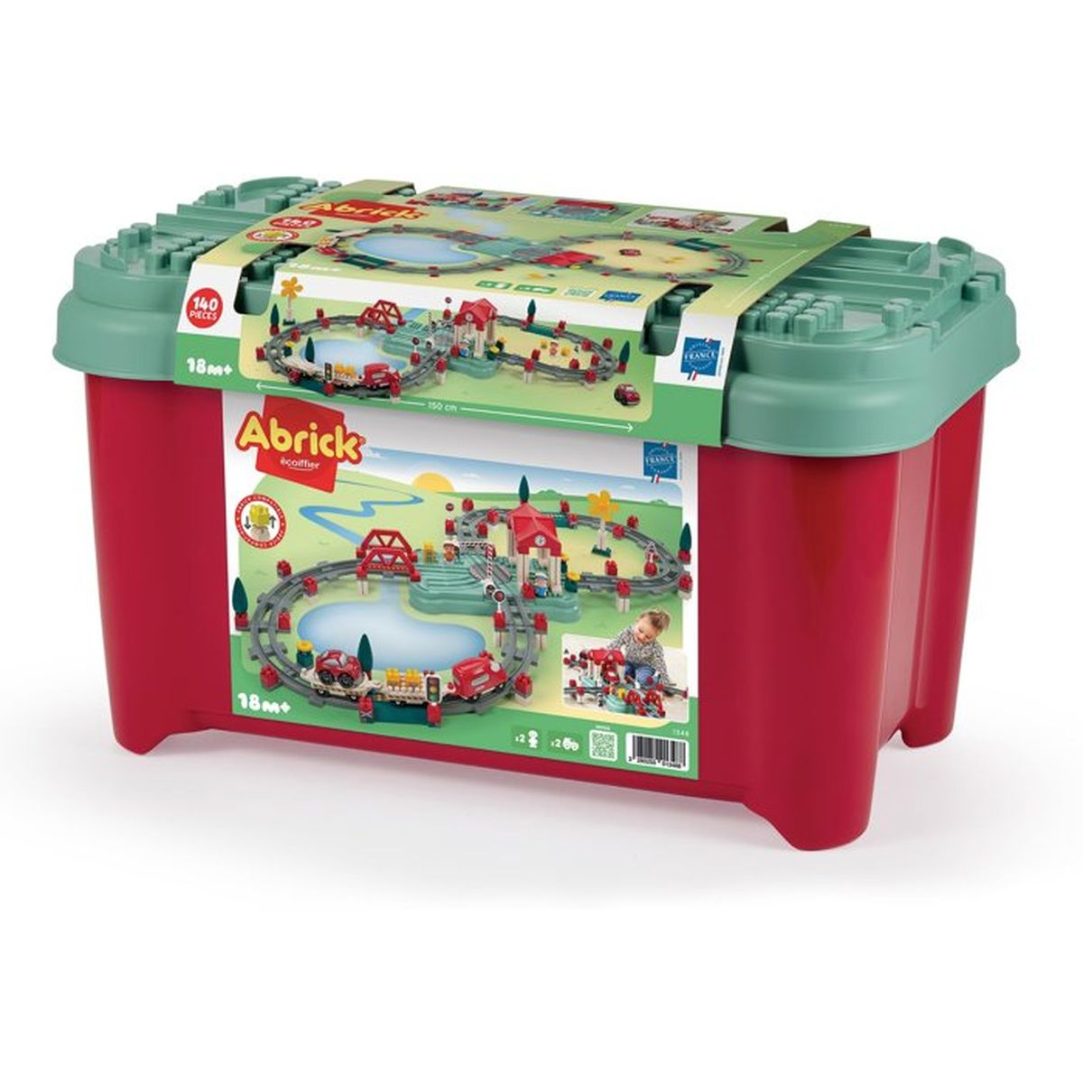 Scatola rossa con set trenino, binari, ponti e case.