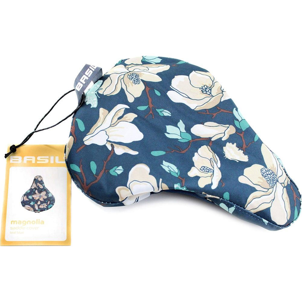 Dunkelblaue Fahrradsattelüberzug mit Magnolienmuster und einem gelben Etikett.