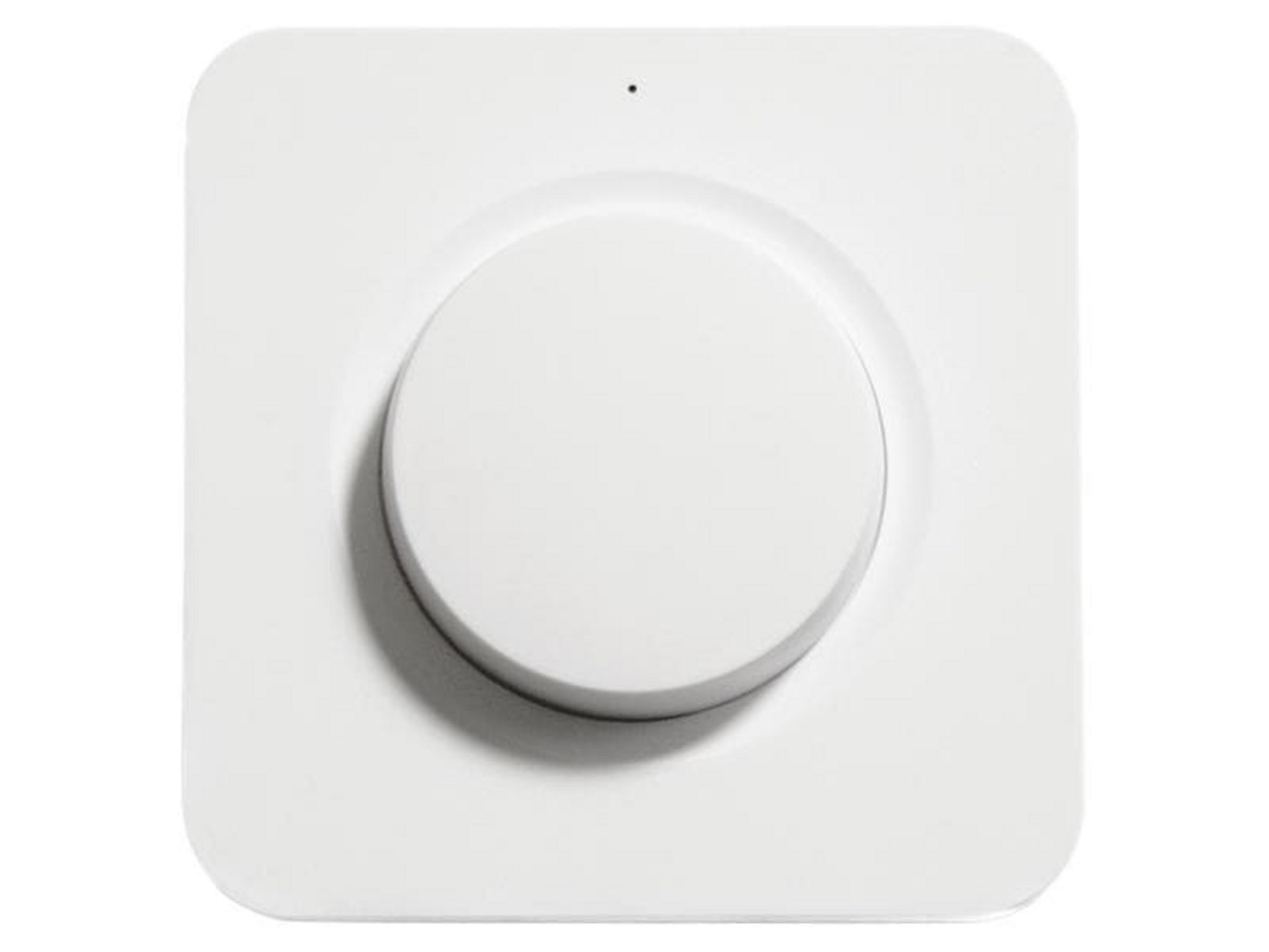 Ein weißer, quadratischer Dimmer mit einem runden Knopf in der Mitte und einem kleinen Punkt.