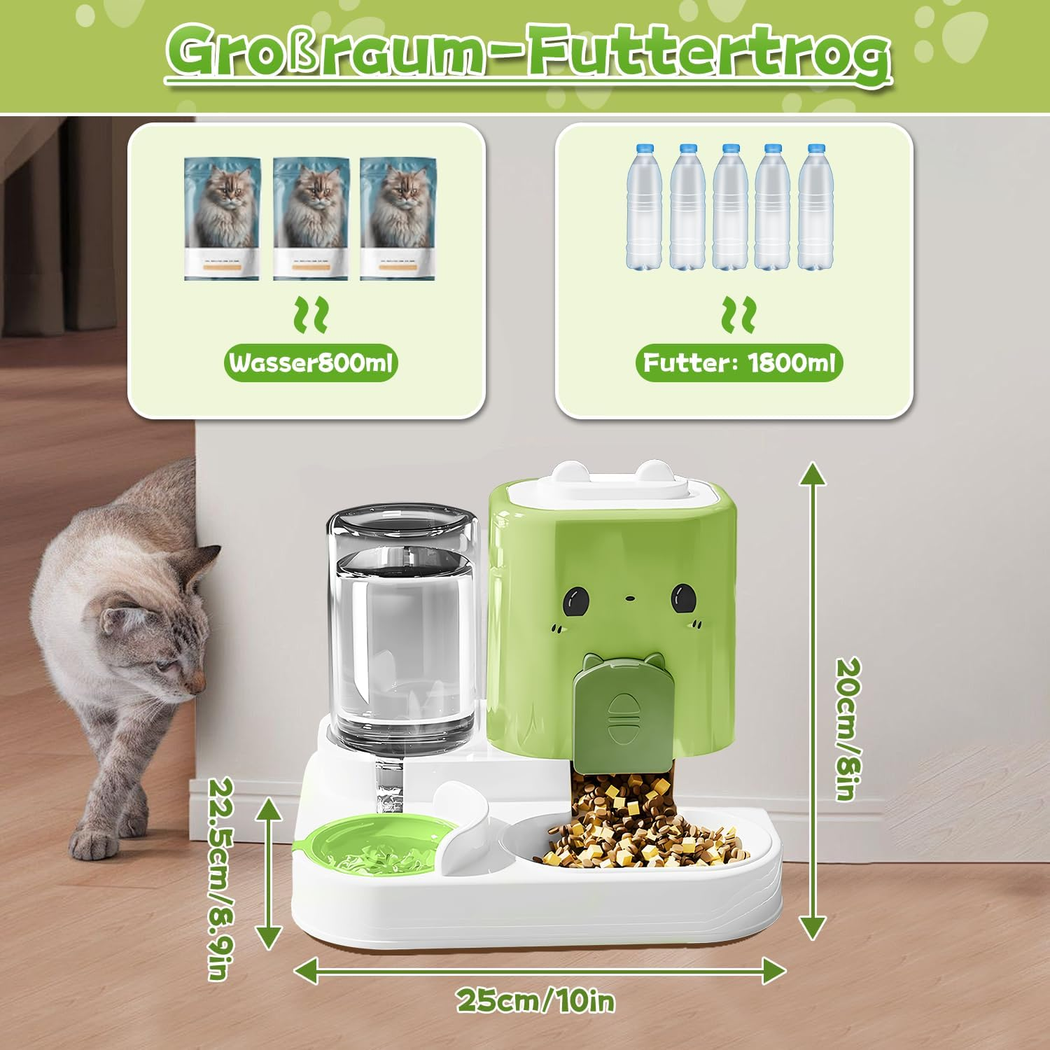 Ein grüner Futterautomat mit Katzengesicht, gefüllt mit Futter. Daneben ein Wasserspender.