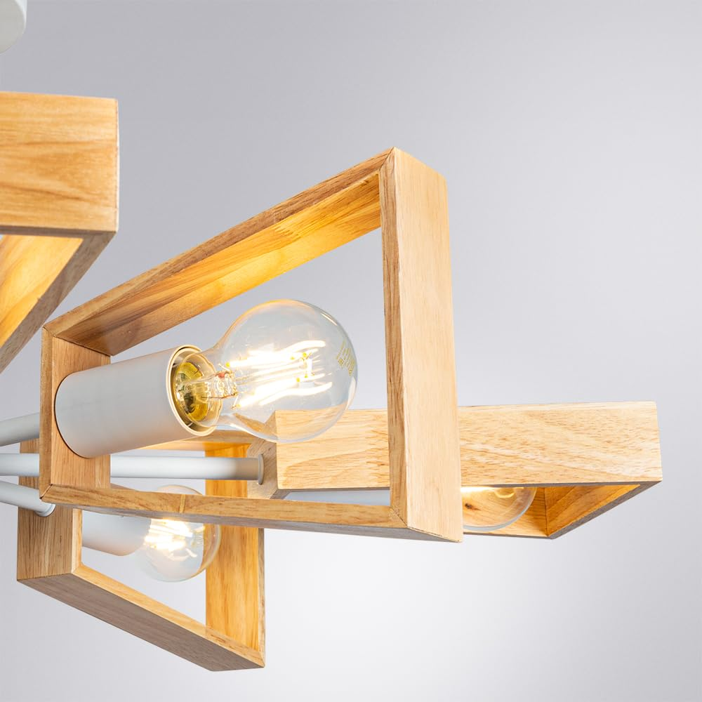 Eine Lampe mit Holzrahmen und Glühbirnen vor hellem Hintergrund.