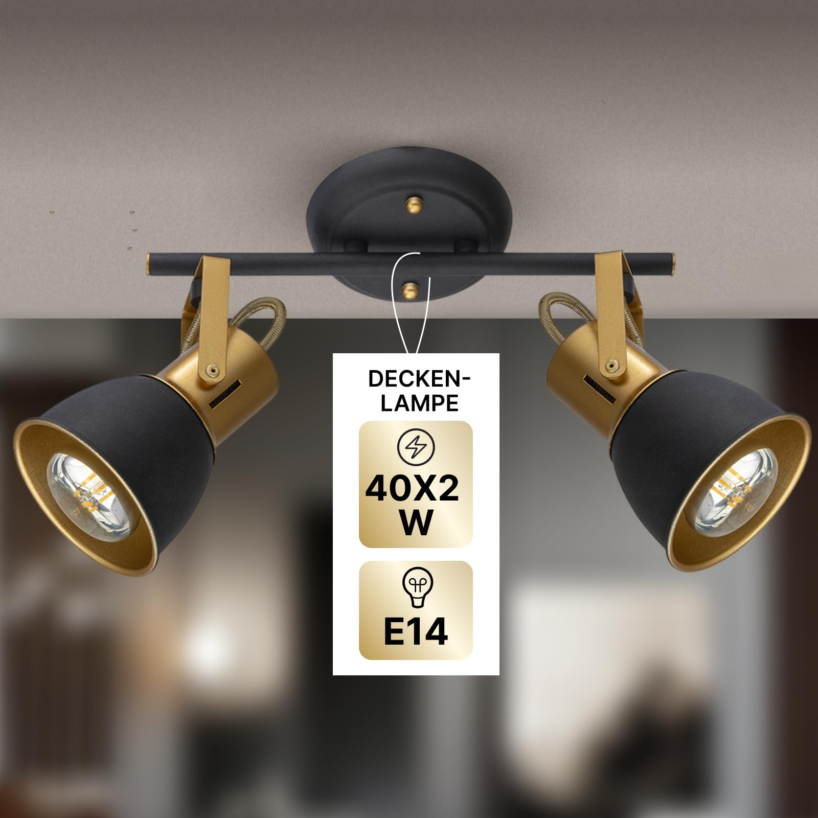 Eine schwarze und goldene Deckenleuchte mit zwei verstellbaren Strahlern.