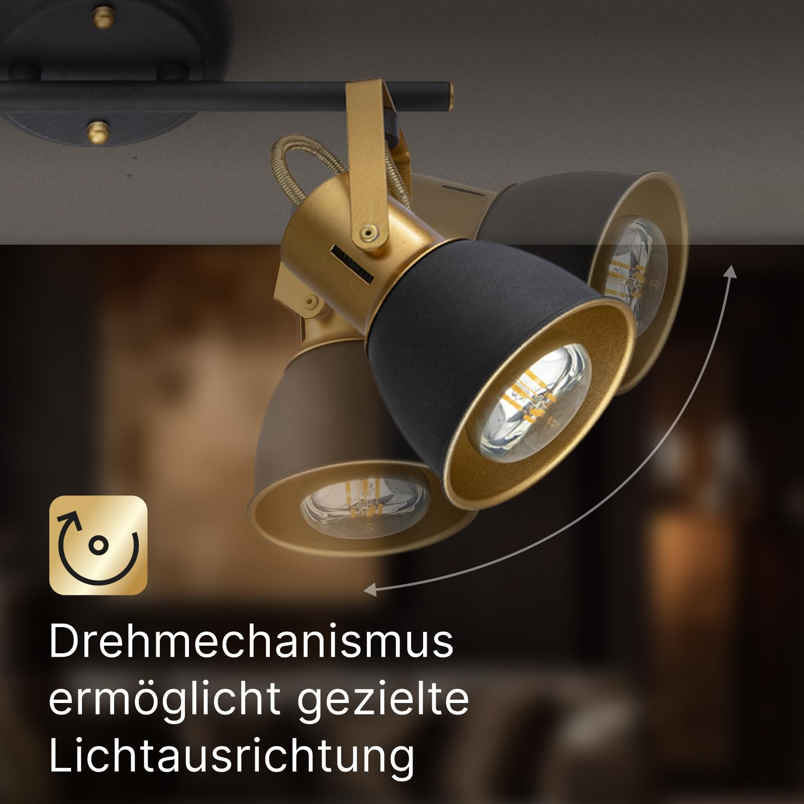 Schwarzer Deckenstrahler mit Goldakzenten, schwenkbare Spots.