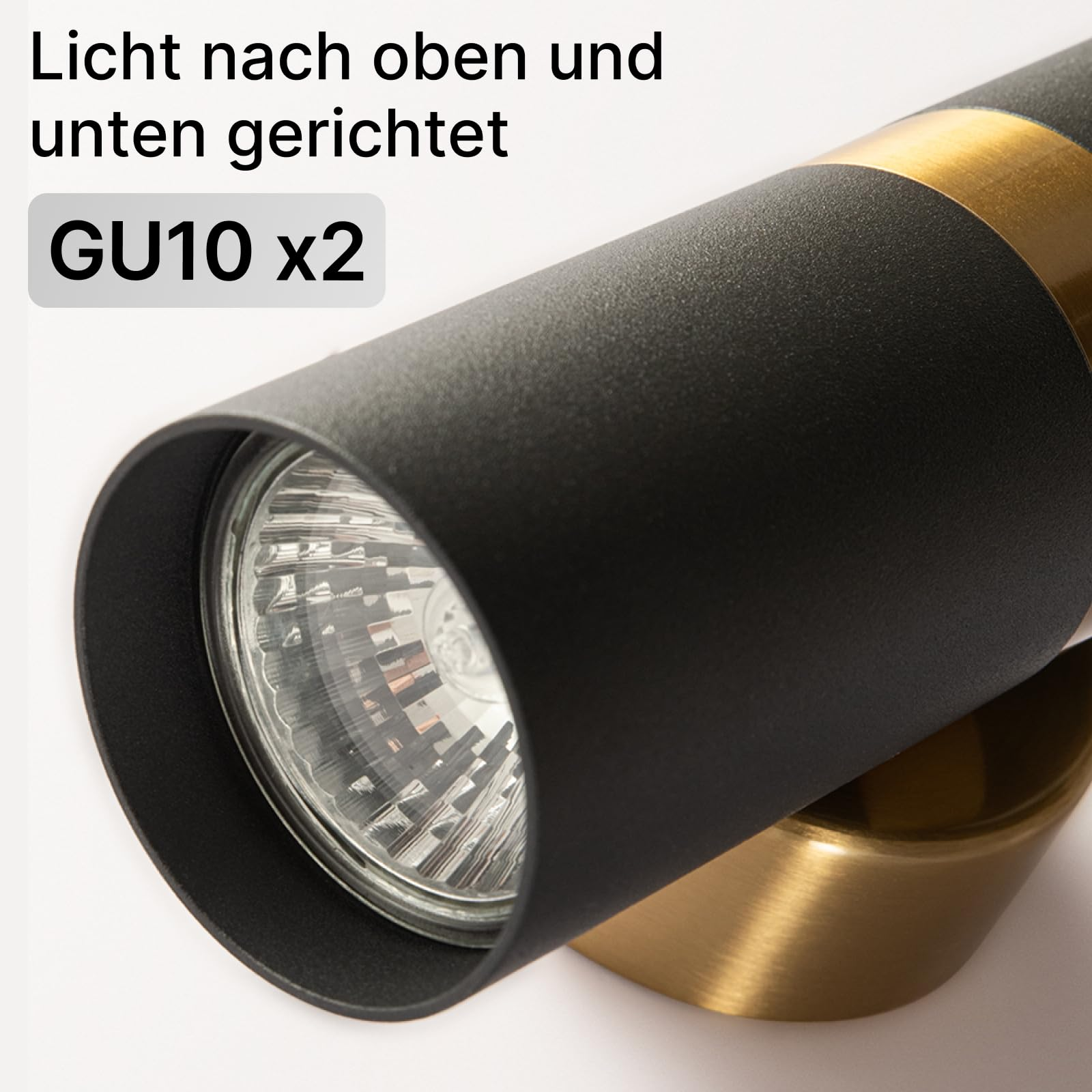Schwarzer Strahler mit Messingdetail und GU10-Leuchtmittel.