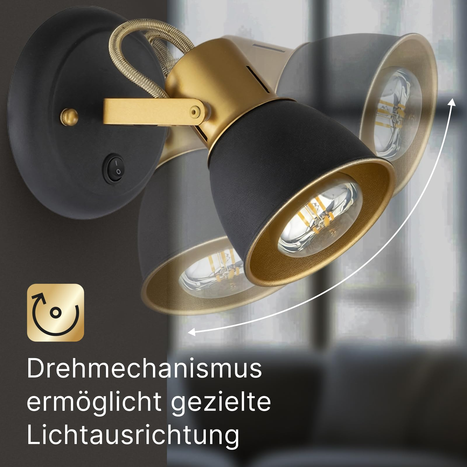 Schwarze Wandleuchte mit zwei goldfarbenen Spots, schwenkbar.