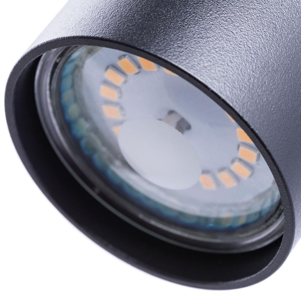 Nahaufnahme einer schwarzen Zylinderlampe mit sichtbaren LED-Lampen und einem weißen Diffusor.