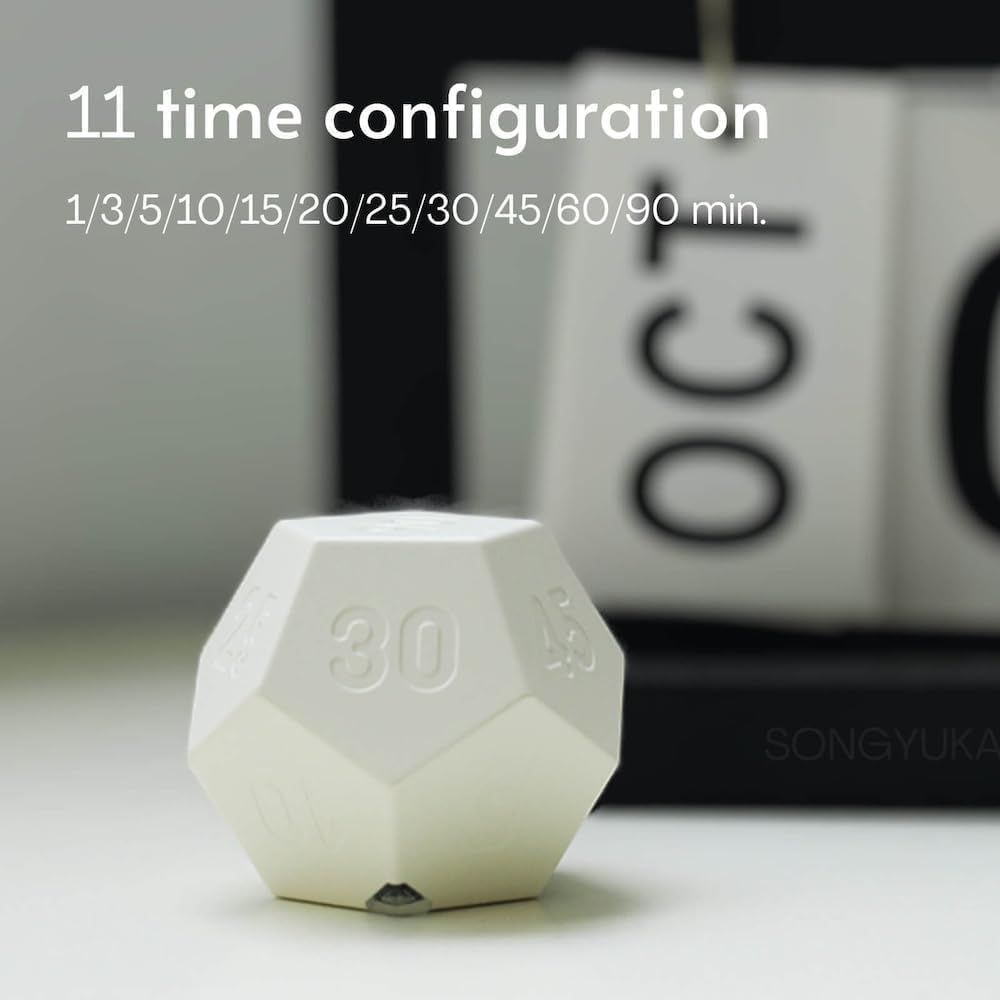 Ein weißer polyedrischer Timer mit der Zahl 30 auf einer Seite. Im Hintergrund ein Kalender.