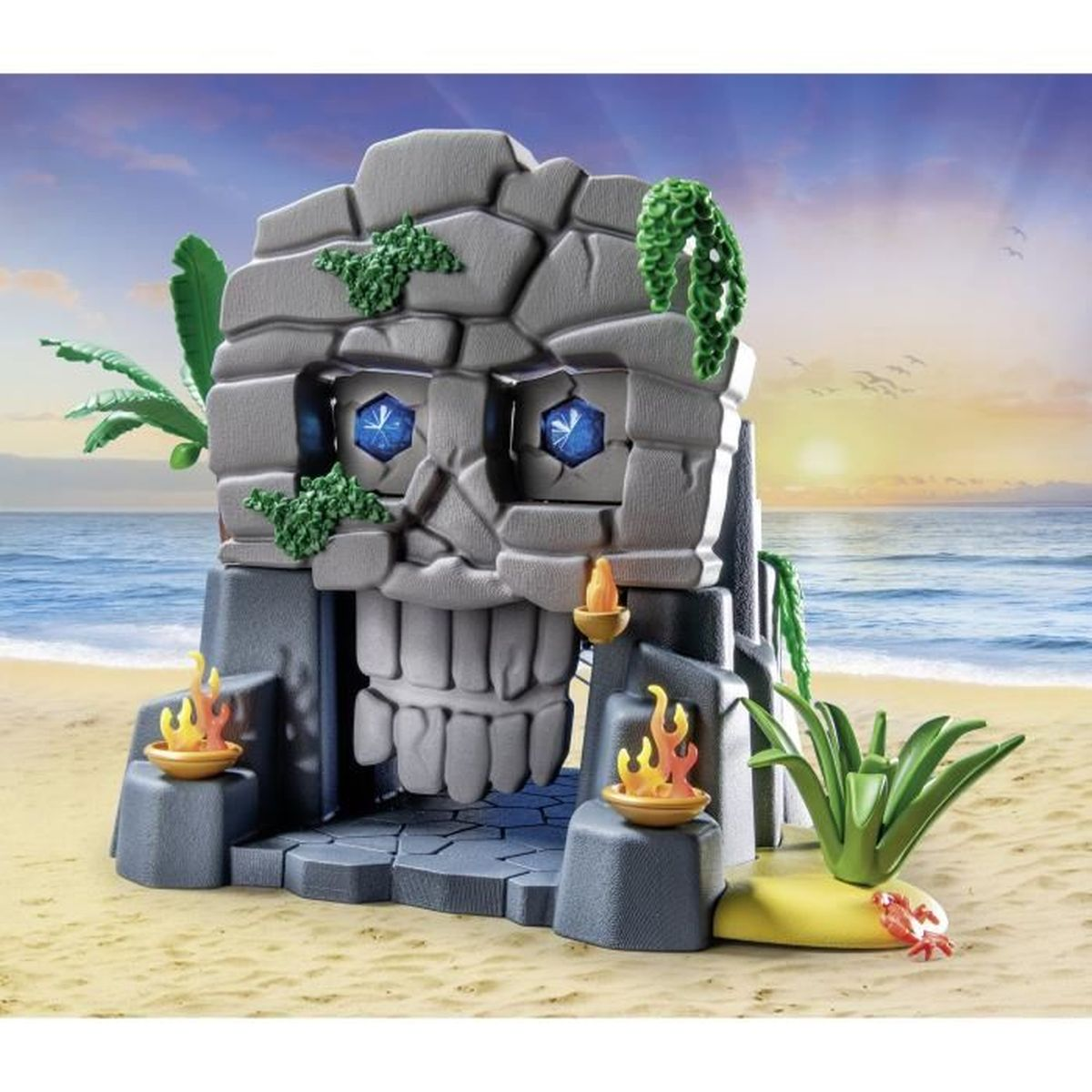 Estructura con forma de calavera en playa con ojos de gema azul y llamas.