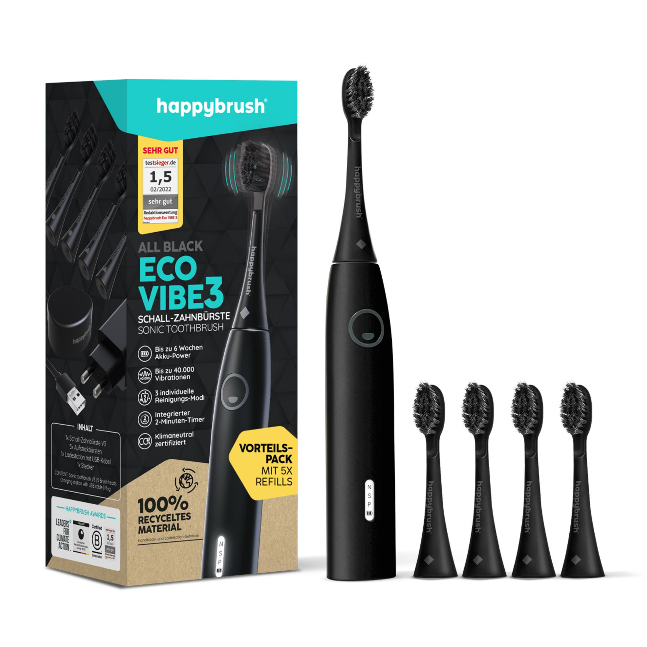 Schwarze Happybrush Schallzahnbürste mit Ladezubehör und Ersatzköpfen.