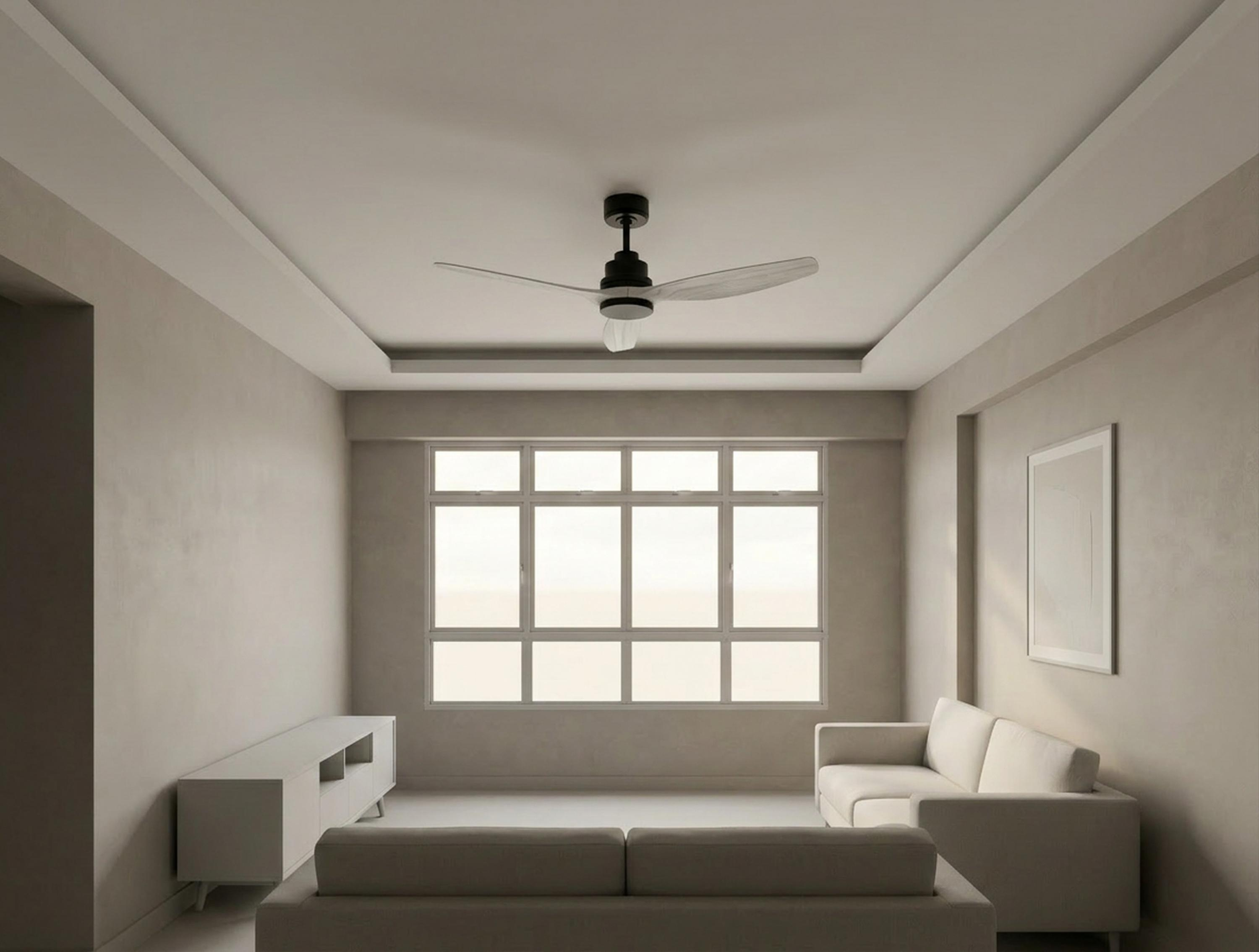 Una sala de estar luminosa con dos sofás, un mueble de TV y un ventilador de techo.