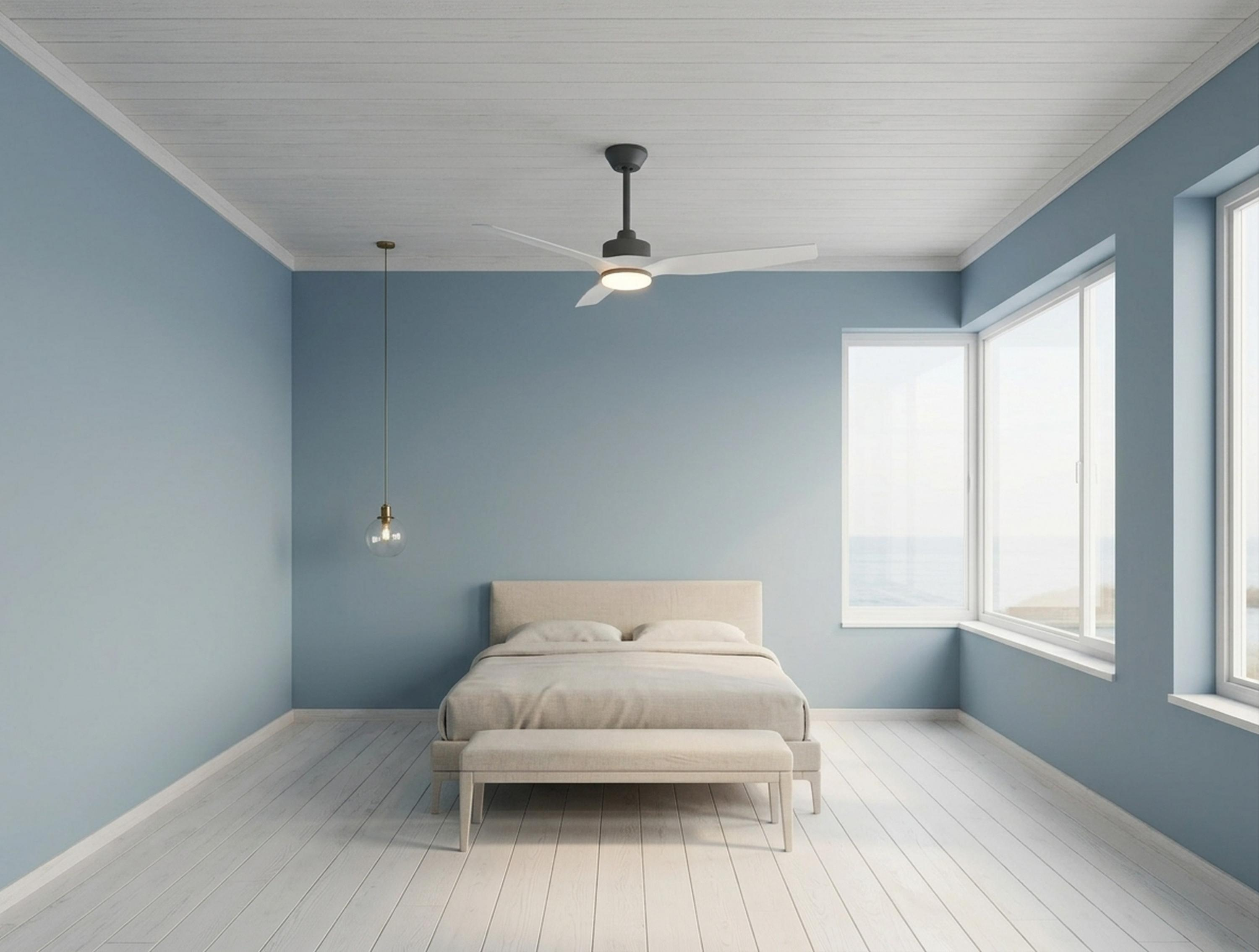 Un dormitorio con paredes azules, suelo de madera y una cama.