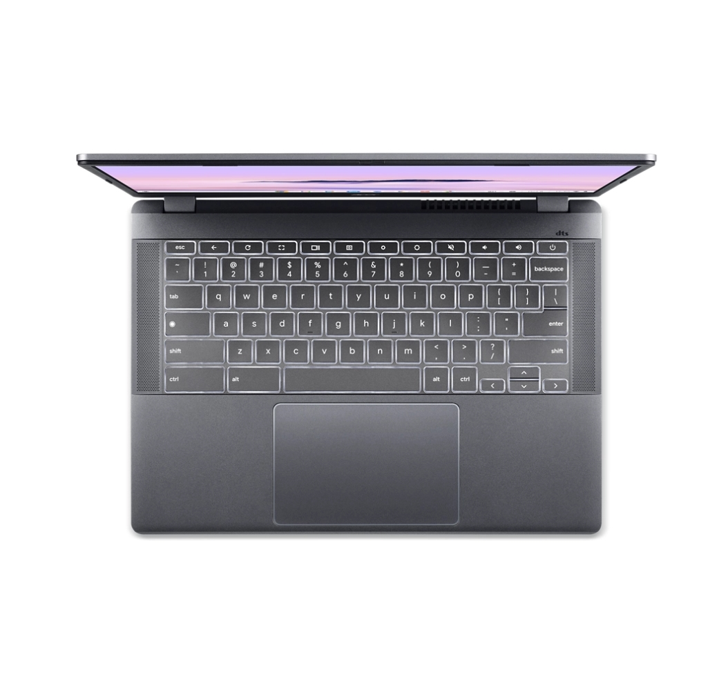 Un laptop grigio scuro è aperto, mostra una tastiera illuminata e uno schermo con un tenue bagliore viola.