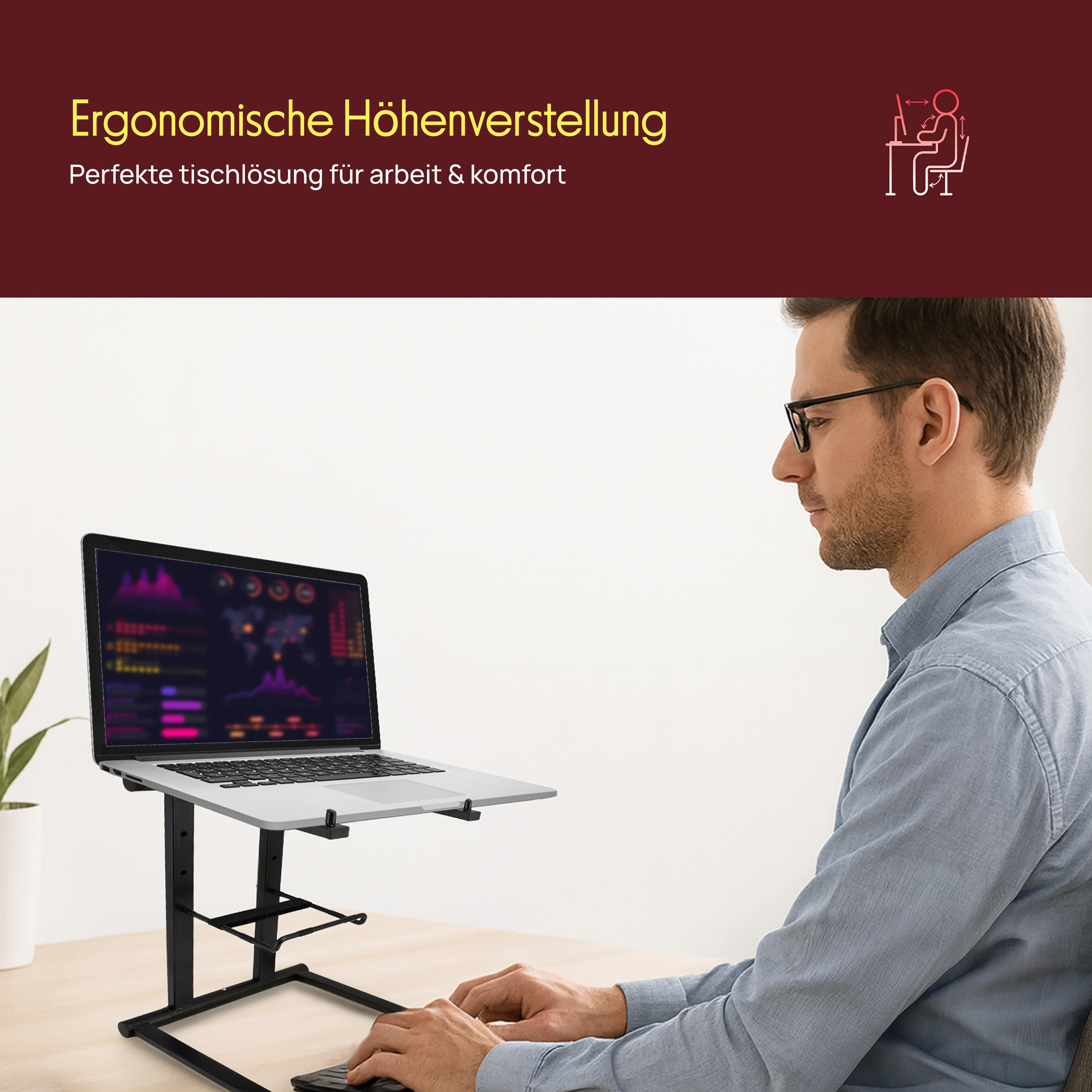 Mann am Schreibtisch mit Laptop auf einem Ständer. Der Laptop zeigt Diagramme.