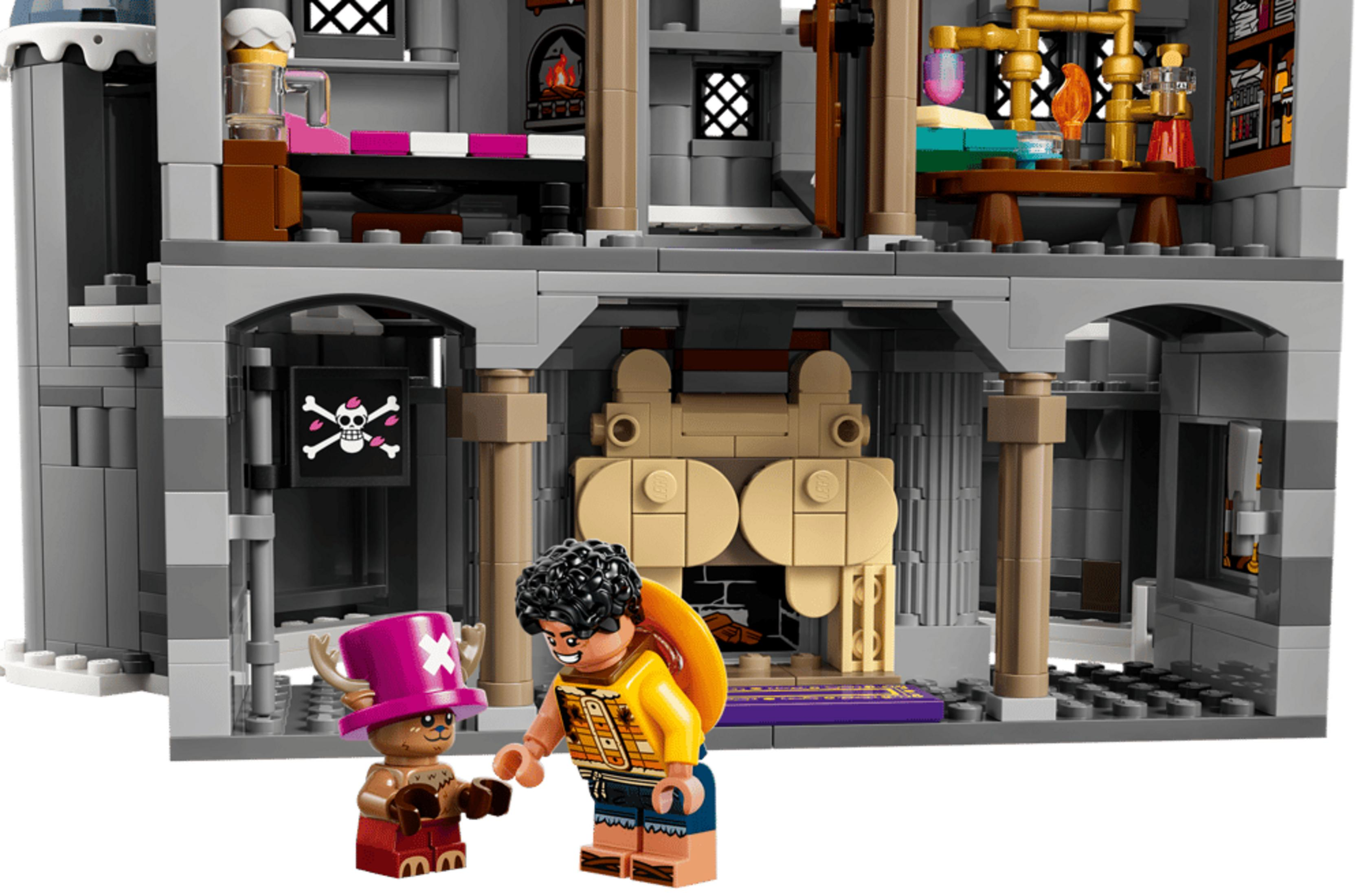 Dos figuras de Lego frente a un castillo. Una figura lleva un sombrero rosa con cuernos.