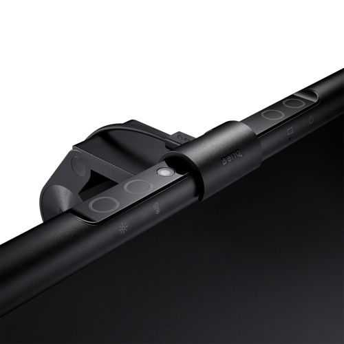 Black monitor lamp with touch sensors and BenQ logo, mounted on a black screen.