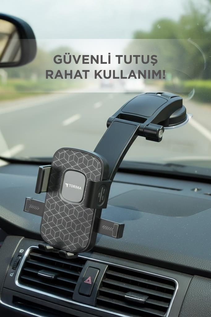 Gösterge panelinde desenli siyah araç telefonu tutucu, yol manzarası.